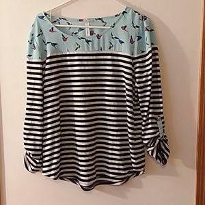 Black and white striped birds top
